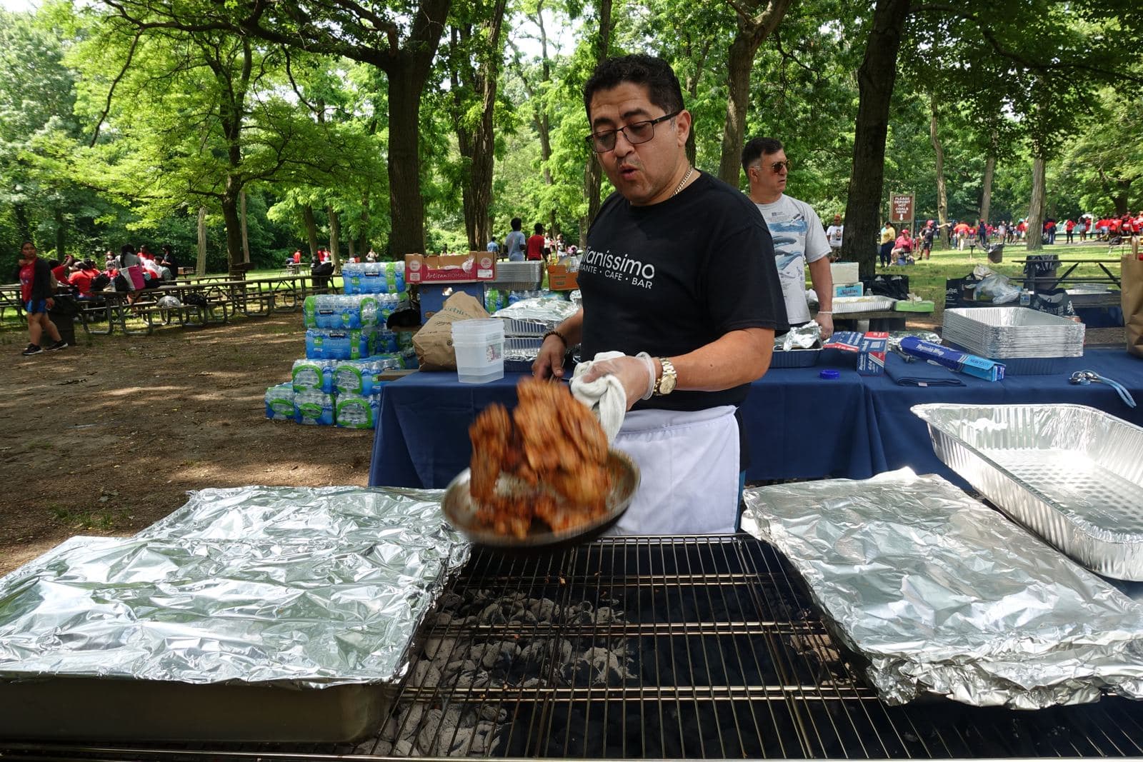 Richmond Tours staff grilling chicken for the Field Day BBQ