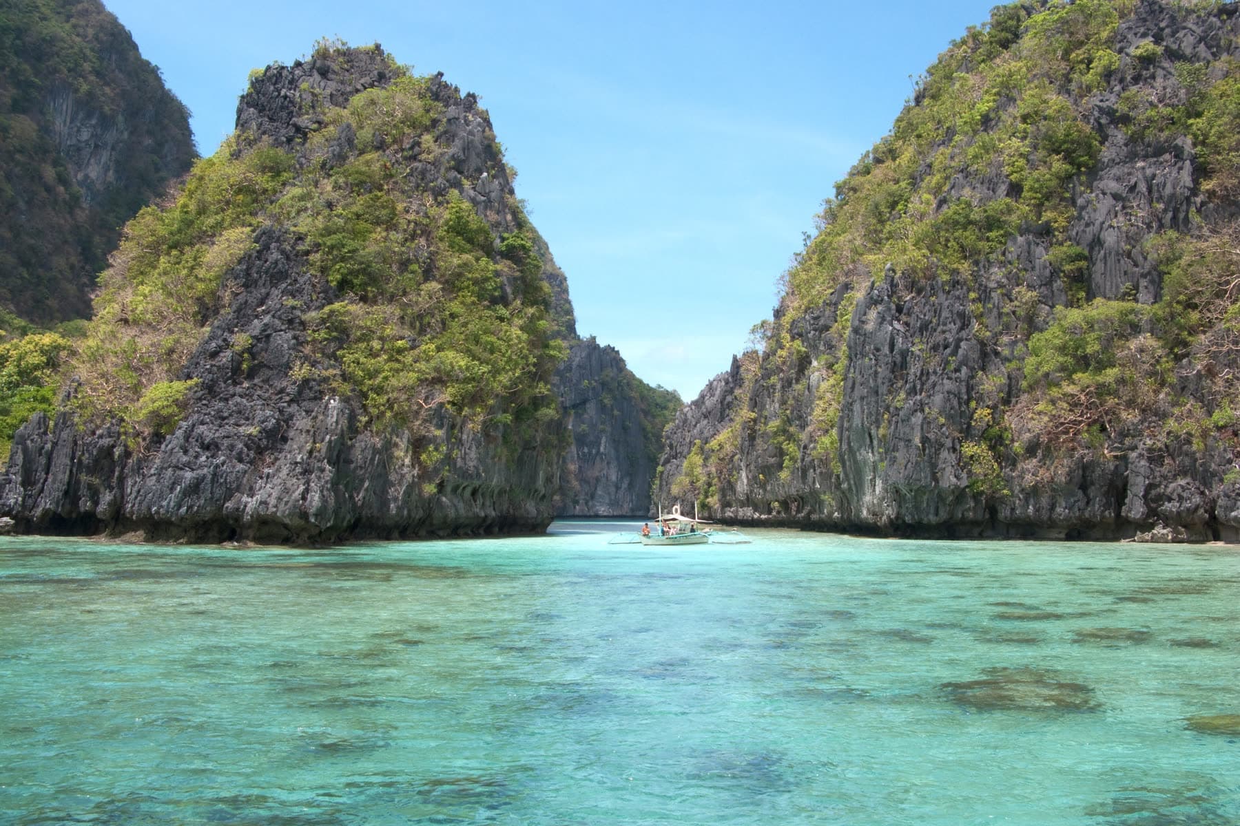 Limestone islands rising from a turquoise lagoon at El Nido in Palawan, the Philippines