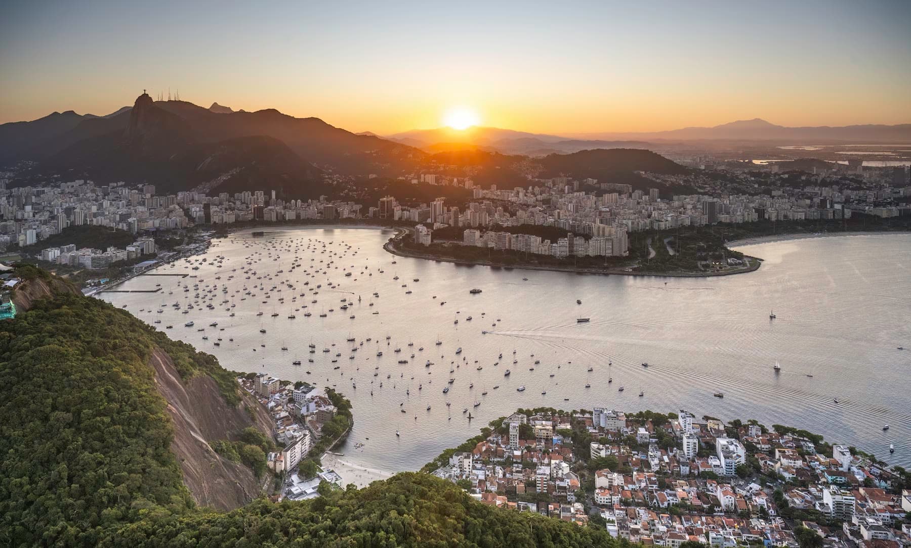 Rio de Janeiro at sunset, with Christ the Redeemer above the bay