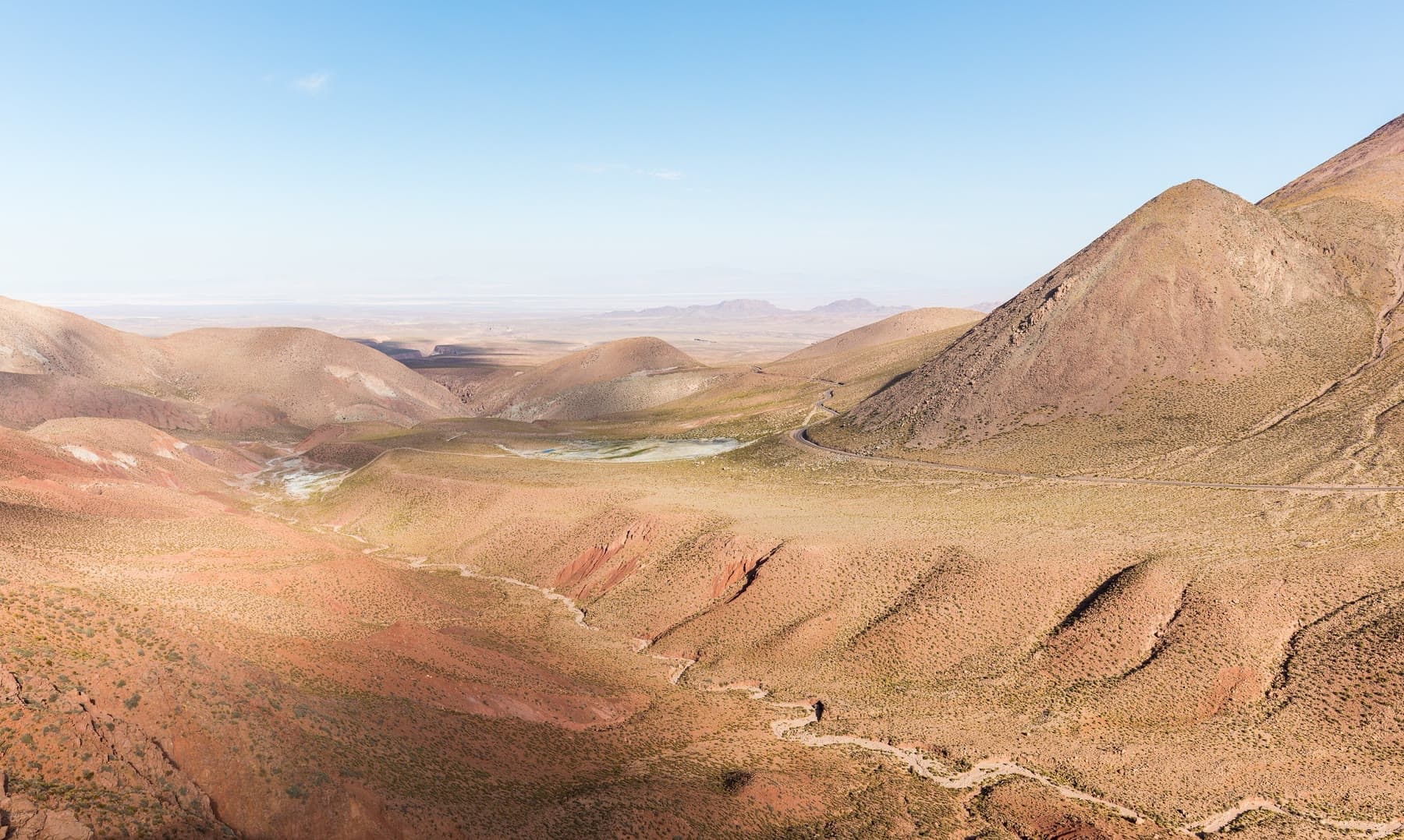 Colored hills and a dry valley in the Atacama Desert near Calama, Chile