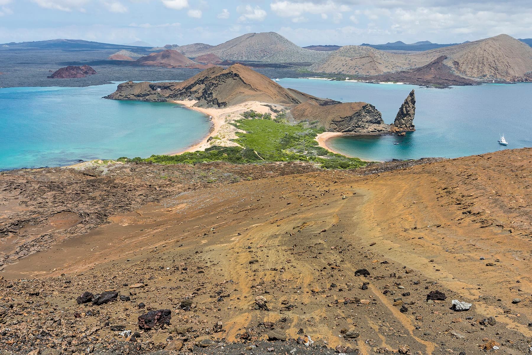 Pinnacle Rock and volcanic hills on Bartolomé Island in the Galápagos