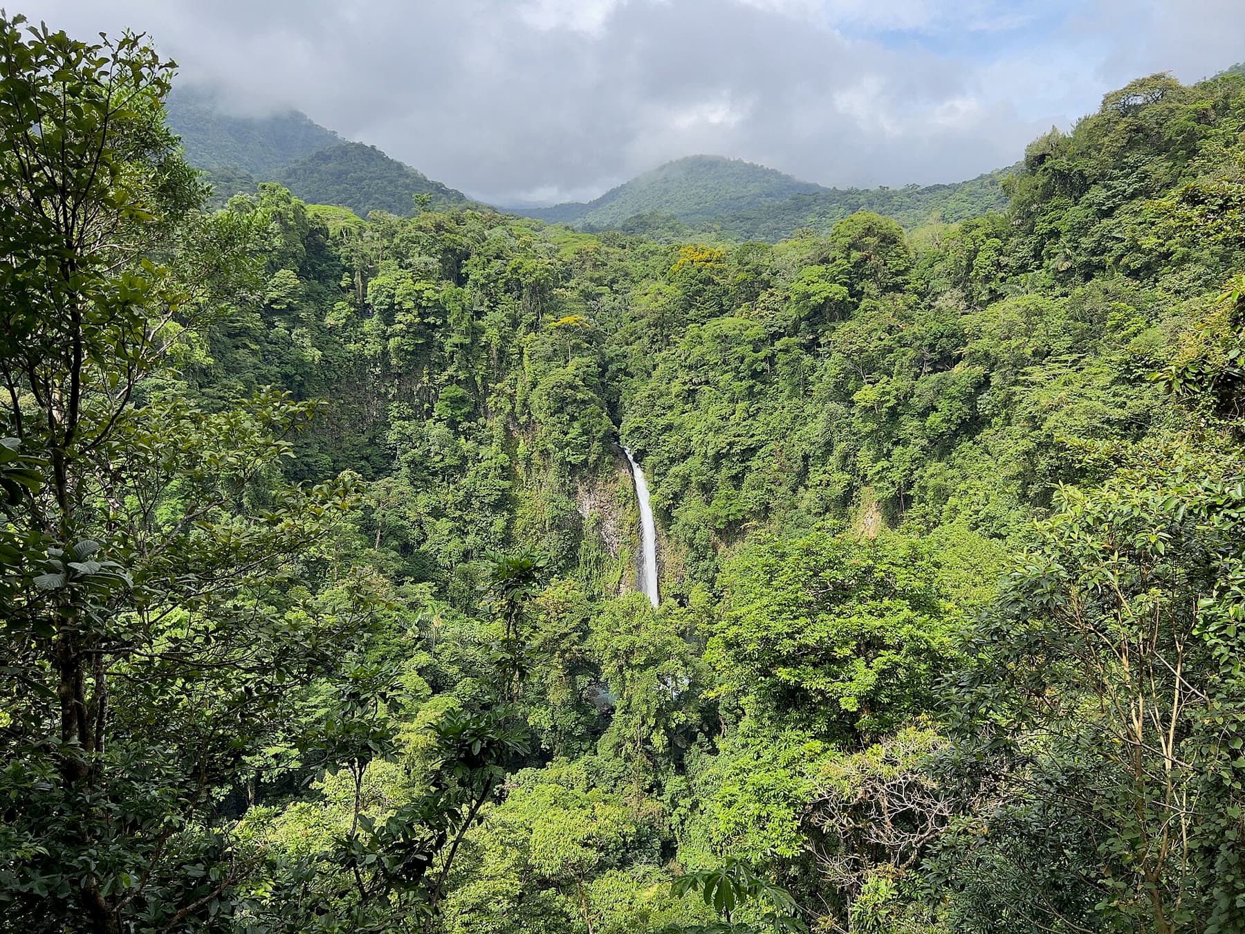La Fortuna waterfall dropping through rainforest near Arenal, Costa Rica