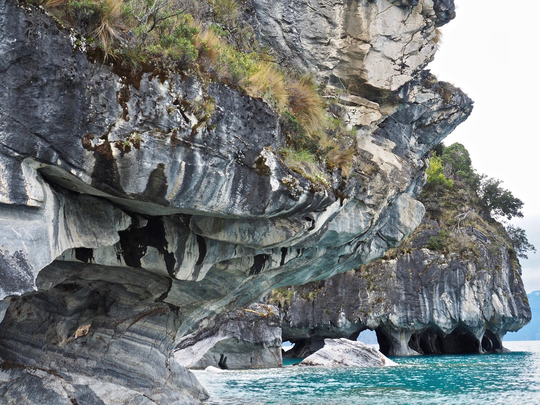 Marble caves along a turquoise lake in Chilean Patagonia