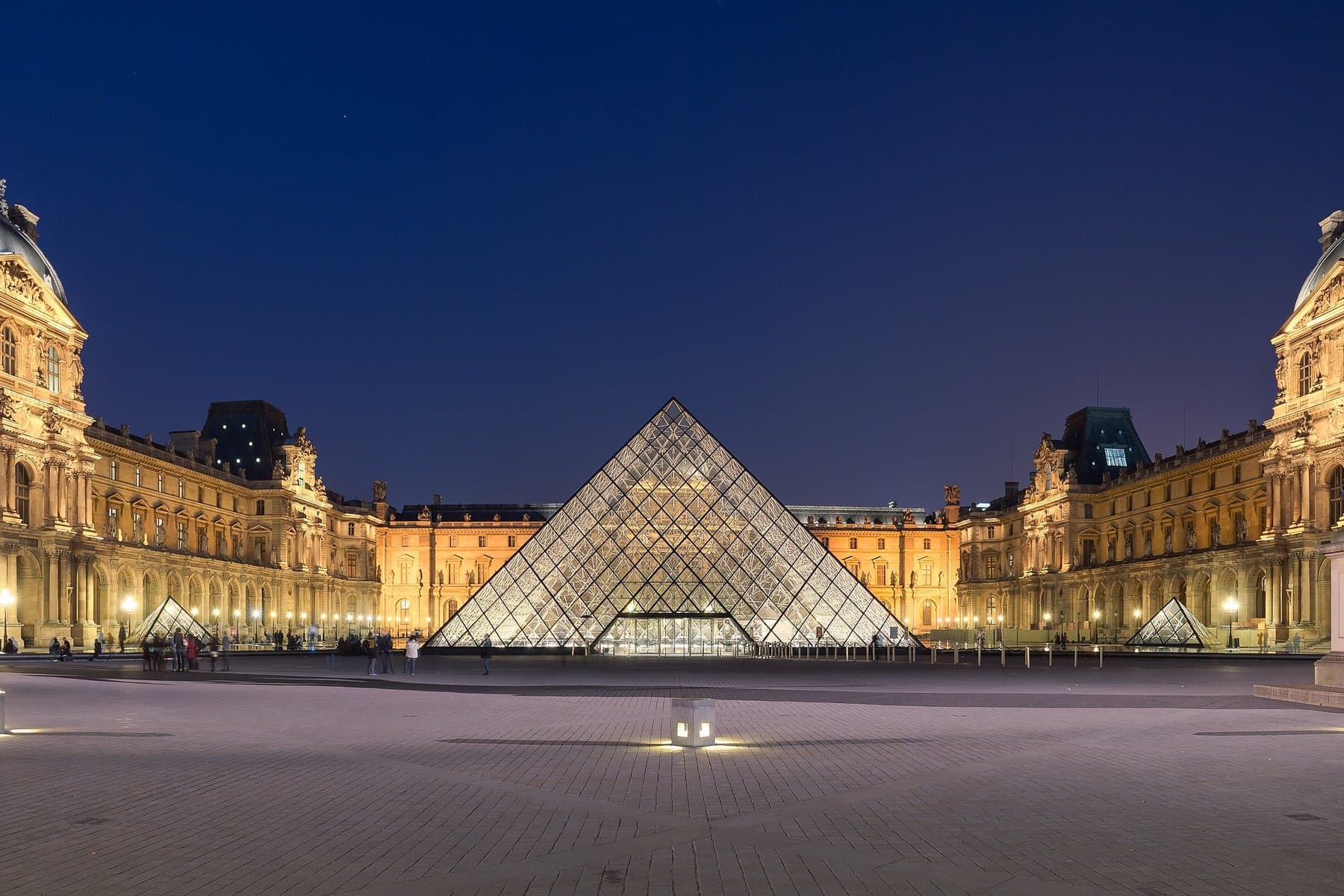 The Louvre pyramid in the Cour Napoléon at night