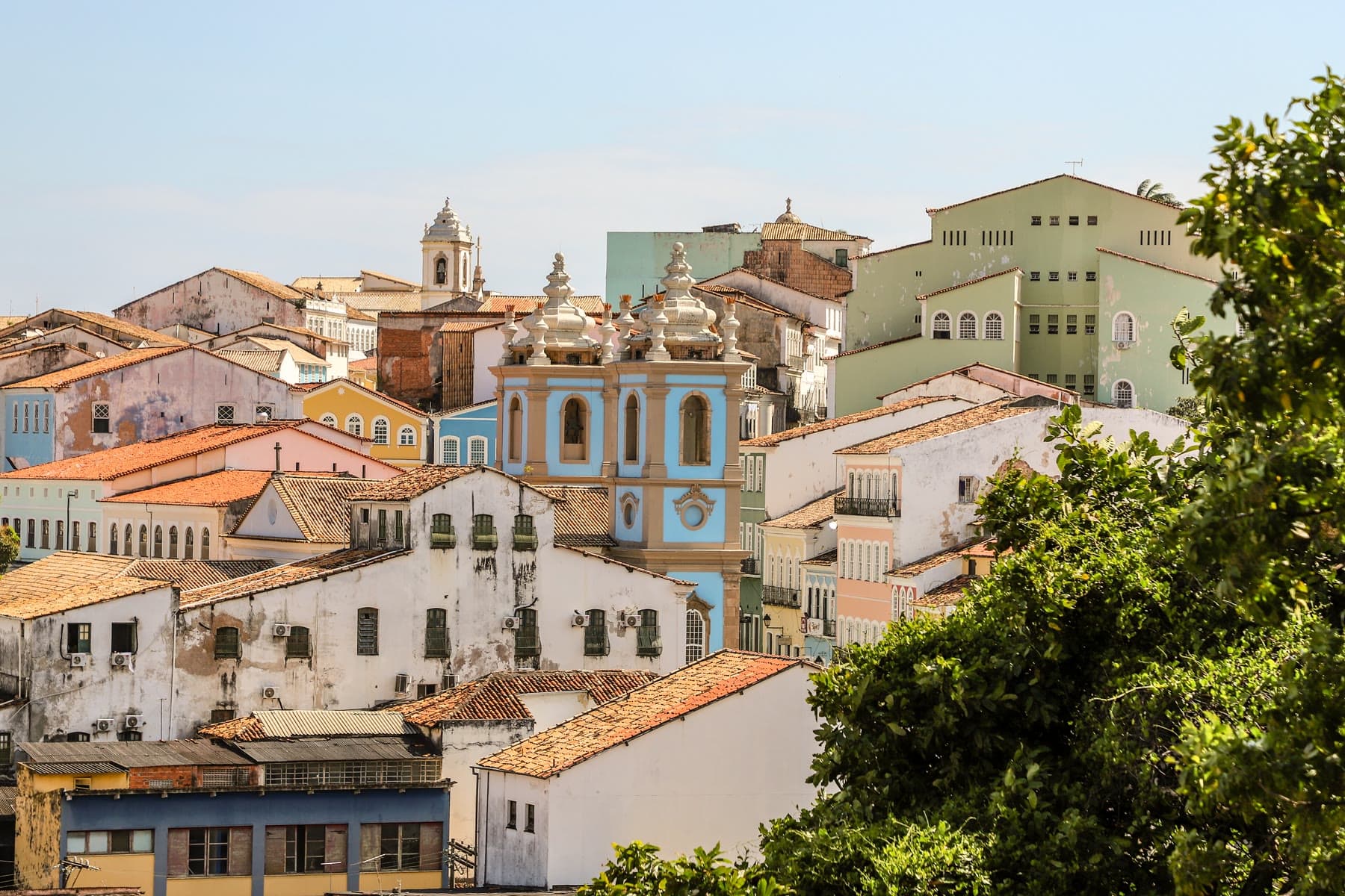Colorful colonial buildings and a church tower in Pelourinho, Salvador