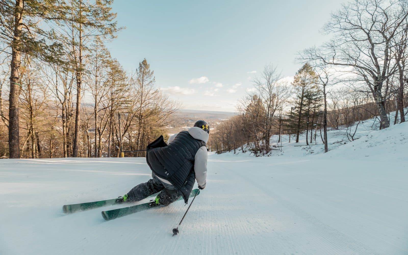 A skier on the snowy slopes at Camelback Resort