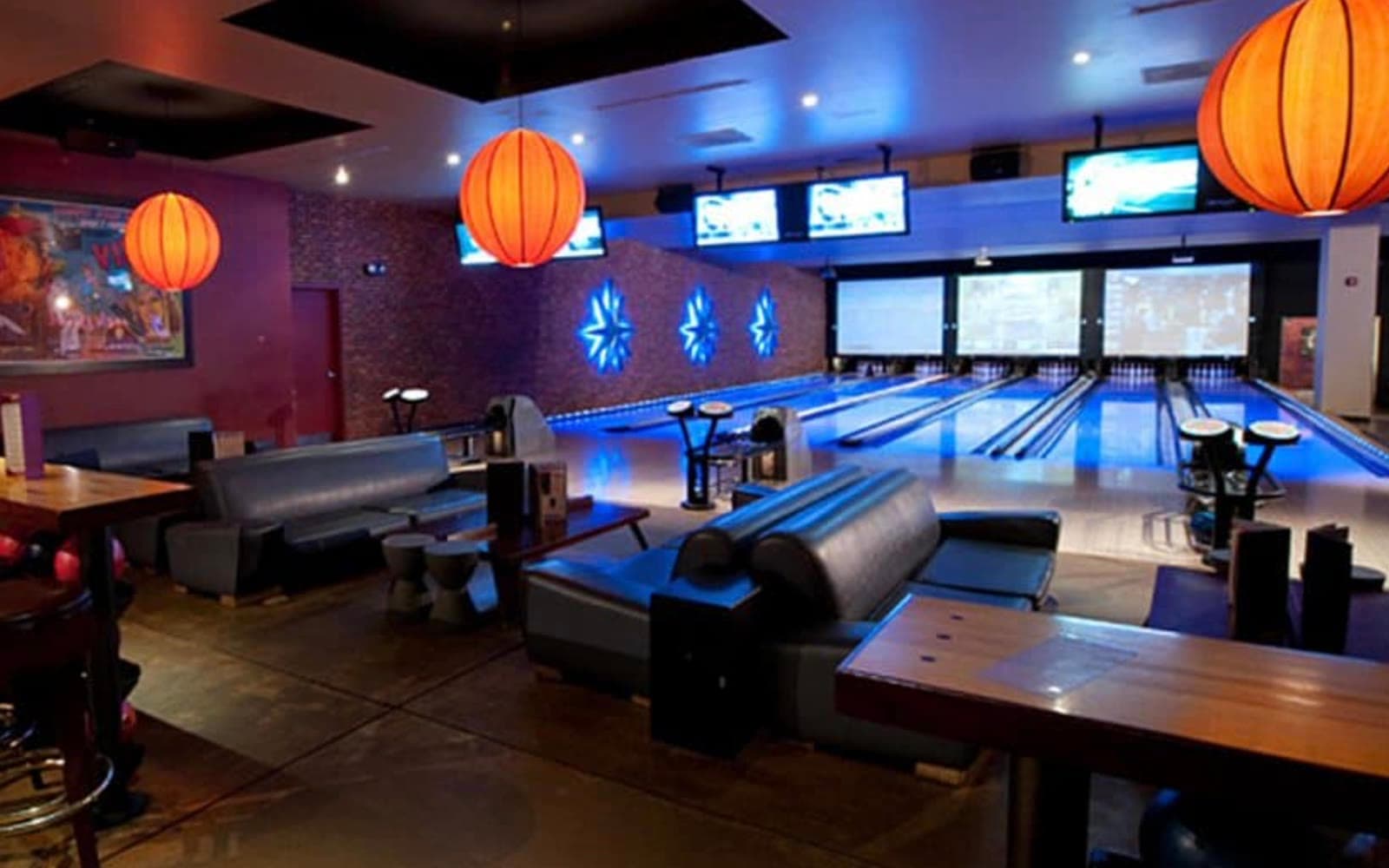 The bowling lanes and lounge at Frames Bowling, with orange lanterns