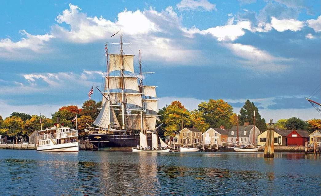 A tall ship docked at Mystic Seaport
