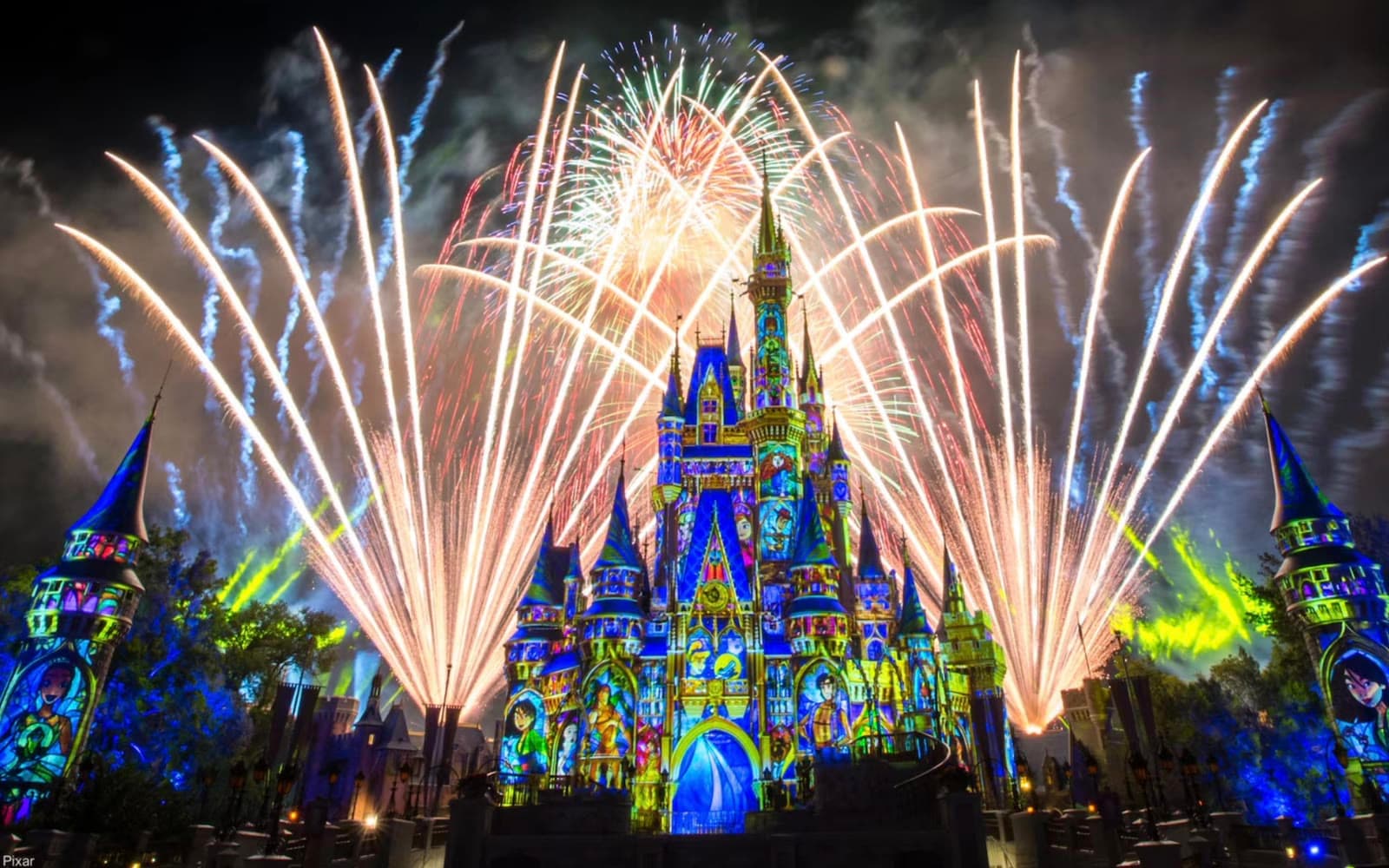 Cinderella Castle at night during a fireworks and projection show
